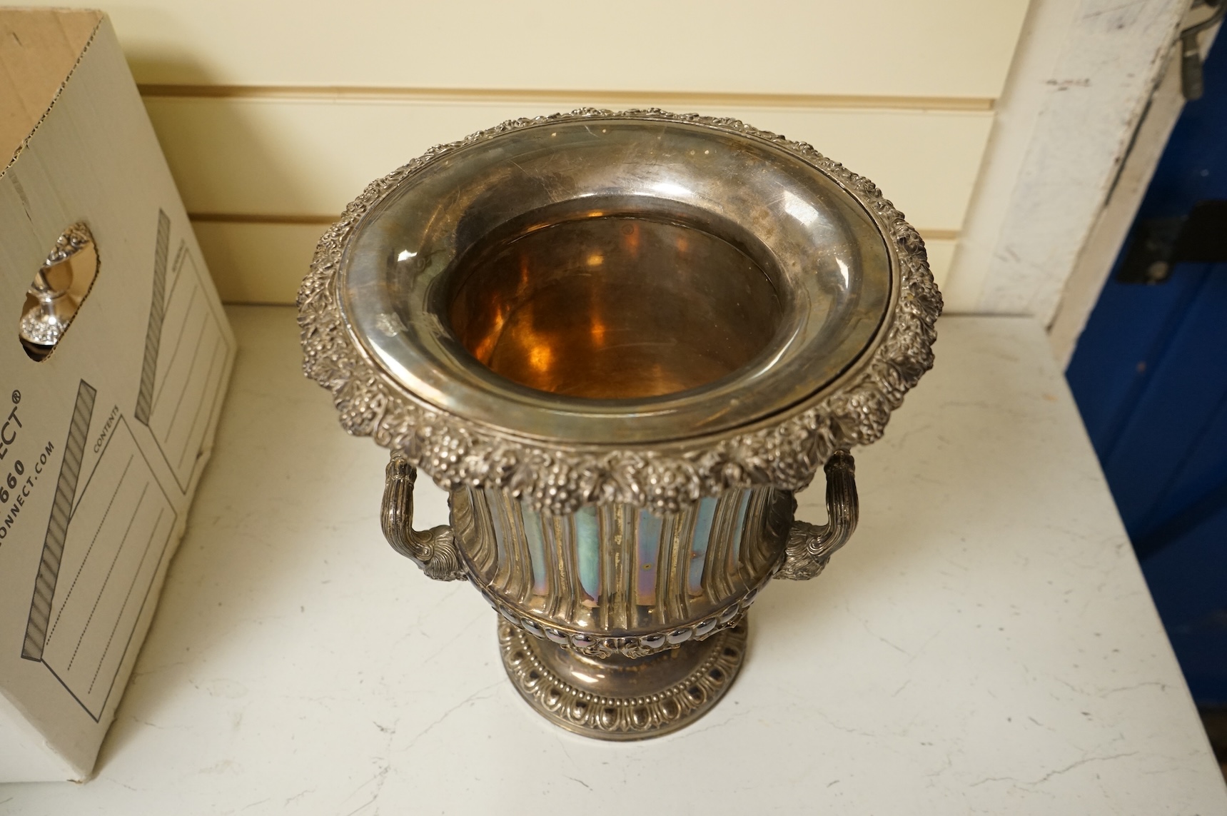 A Victorian silver plated campana wine cooler and removable liner, with vineous cast rim and bacchic mask twin handles, height 26cm.